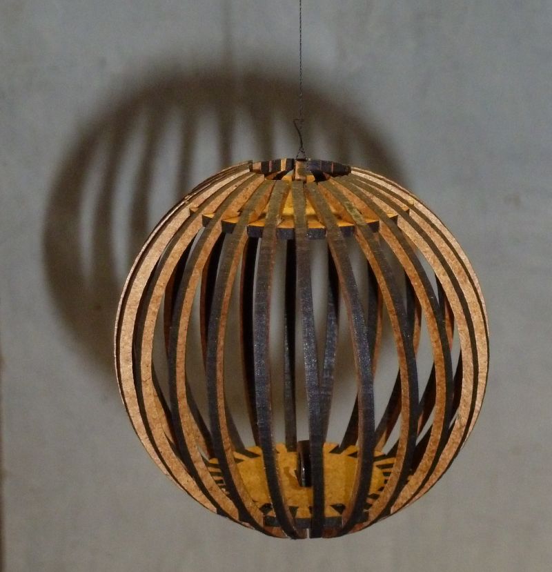 Cage ball decoration, a spherical cage of vertical curved wooden bars