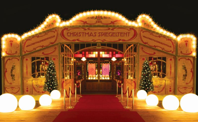 Front view of the Spiegeltent, illuminated for Christmas